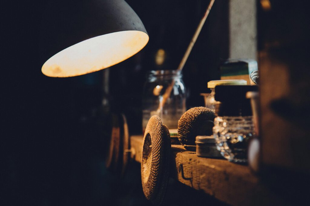 pexels-photo-280014-280014 Explore a cozy, vintage workshop illuminated by warm lighting, showcasing tools and equipment.