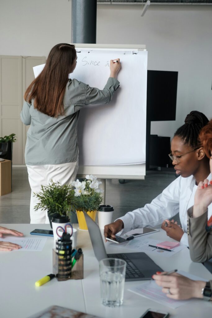 pexels-photo-8067824-8067824 Professional team engaged in a brainstorming session at the office with a focus on planning and cooperation.